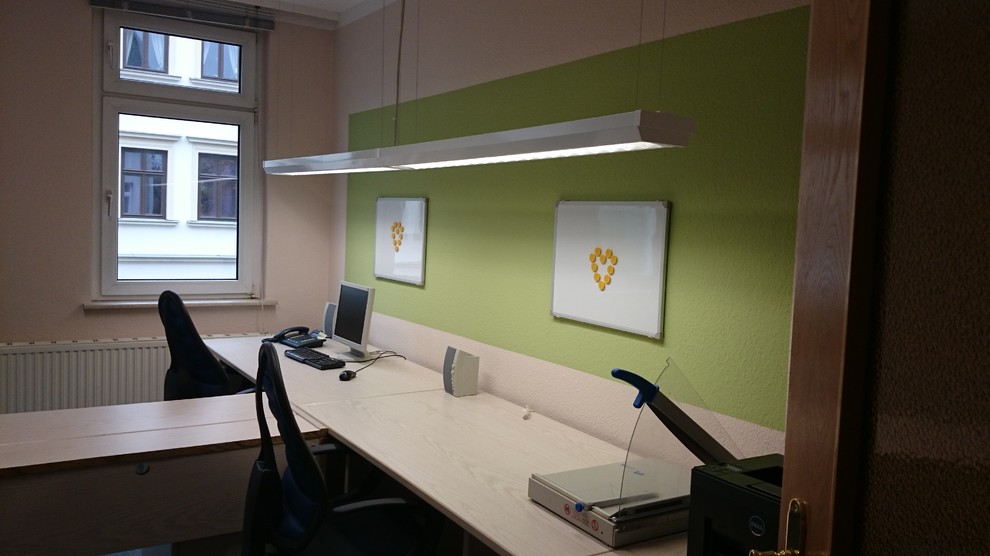 Example of a mid-sized classic freestanding desk carpeted study room design in Leipzig with beige walls