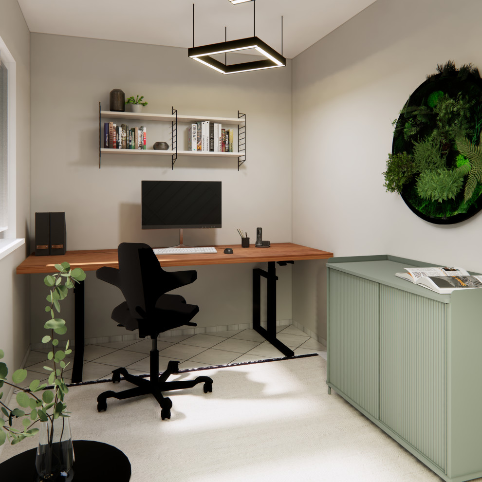 Idéer för ett litet modernt hemmabibliotek, med gröna väggar, heltäckningsmatta, ett fristående skrivbord och beiget golv