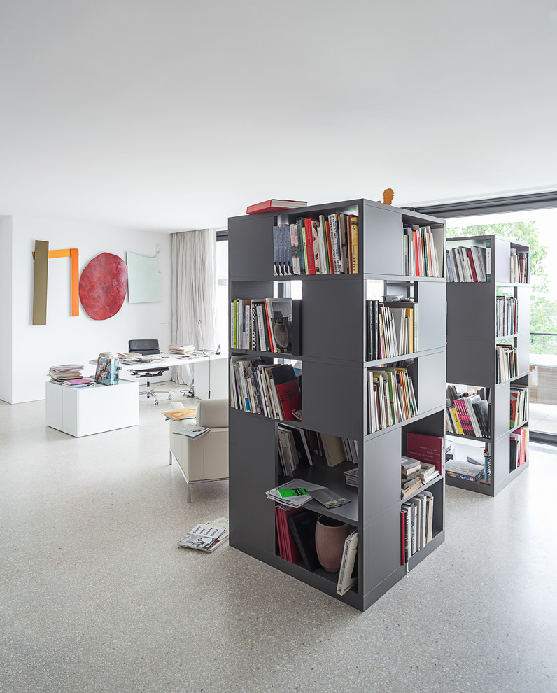 Photo of an expansive contemporary study in Cologne with white walls, a freestanding desk, no fireplace and lino flooring.