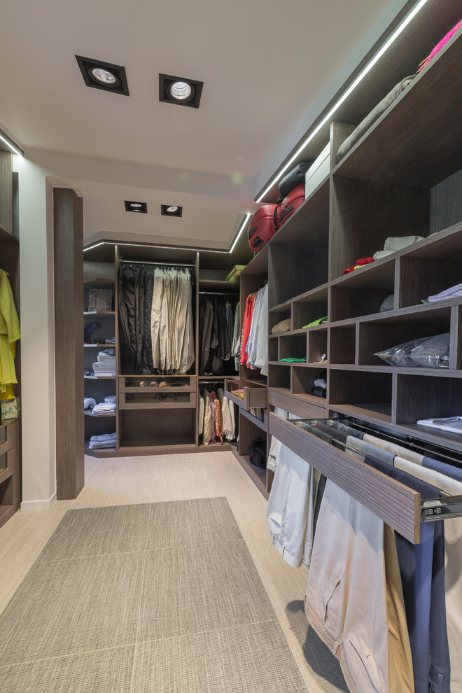 Inspiration for a large contemporary gender-neutral porcelain tile and beige floor walk-in closet remodel in Rome with open cabinets and dark wood cabinets