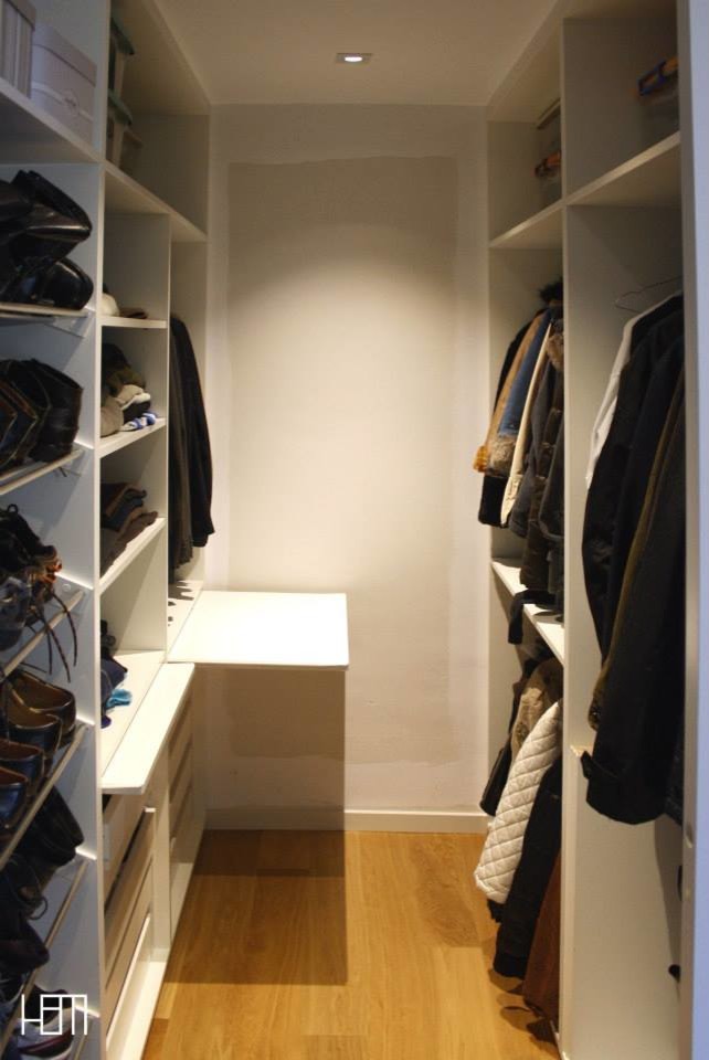 Photo of a medium sized scandinavian gender neutral walk-in wardrobe in Other with open cabinets, white cabinets and medium hardwood flooring.