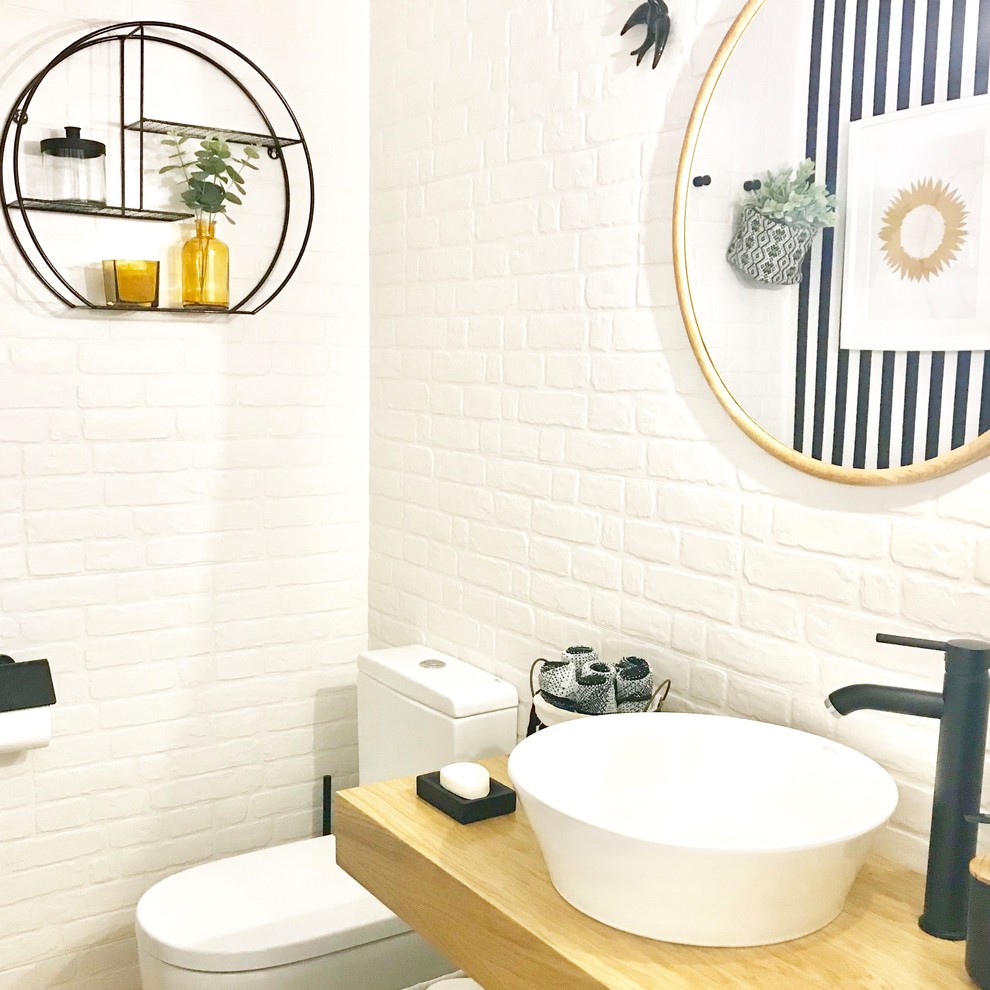 Inspiration for a small scandi cloakroom in Other with open cabinets, medium wood cabinets, a one-piece toilet, white tiles, ceramic tiles, multi-coloured walls, light hardwood flooring, a vessel sink and wooden worktops.