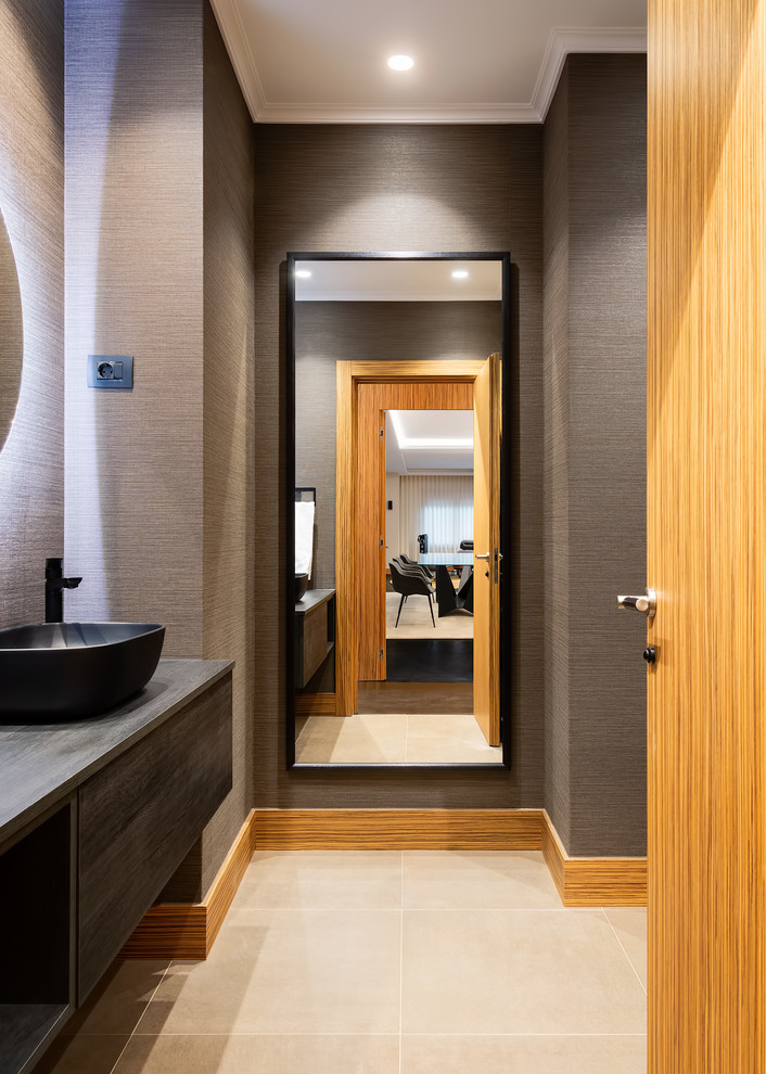 Contemporary cloakroom in Other with flat-panel cabinets, grey cabinets, grey walls, a vessel sink, wooden worktops, beige floors and grey worktops.