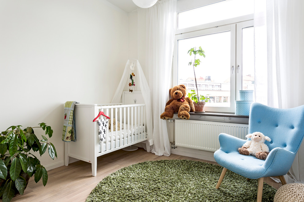 Aménagement d'une chambre de bébé scandinave.
