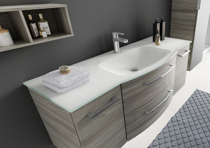 Inspiration for a large traditional ensuite bathroom in Other with flat-panel cabinets, medium wood cabinets, black tiles, black walls and glass worktops.