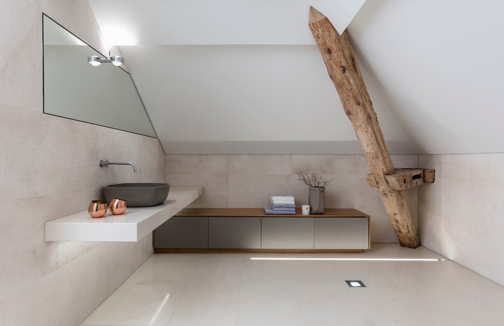 Large modern ensuite bathroom in Other with flat-panel cabinets, grey cabinets, a vessel sink, a two-piece toilet, beige tiles, limestone tiles, white walls, limestone flooring, limestone worktops, beige floors and beige worktops.