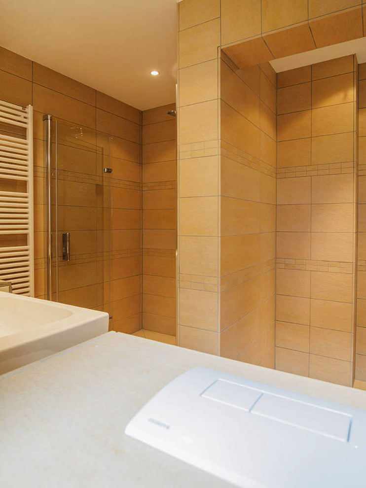 Inspiration for a medium sized contemporary shower room bathroom in Frankfurt with flat-panel cabinets, a two-piece toilet, brown cabinets, a built-in shower, stone tiles, beige walls, porcelain flooring, a console sink and a shower curtain.