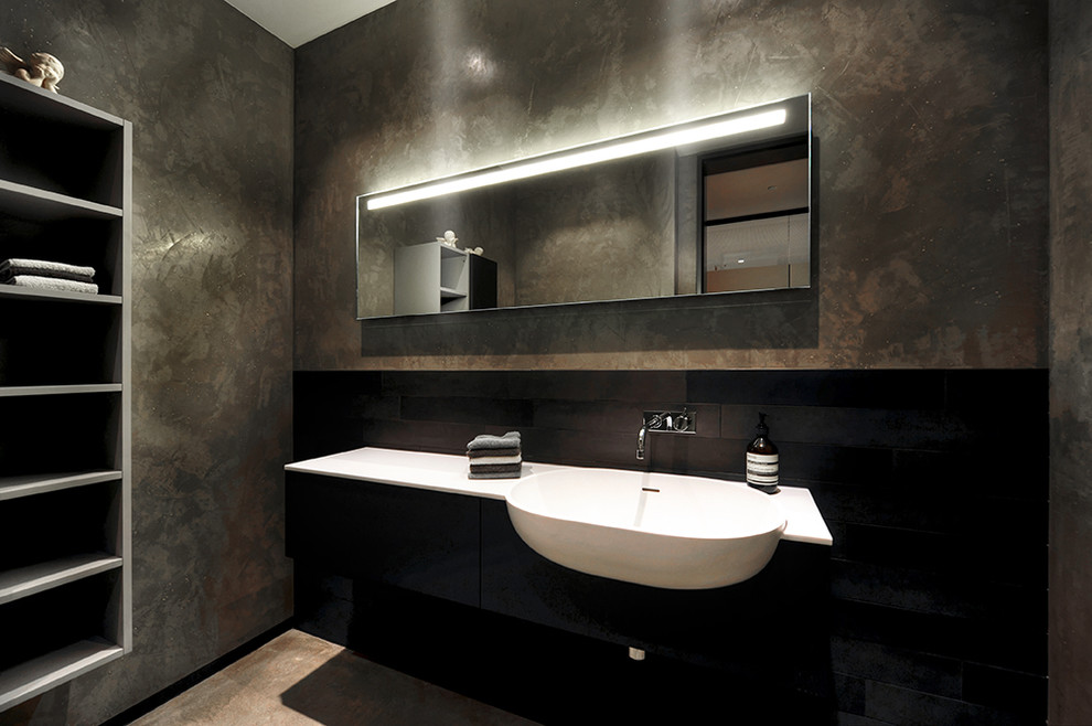 Inspiration for a medium sized contemporary bathroom in Other with flat-panel cabinets, black cabinets, brown walls and a built-in sink.