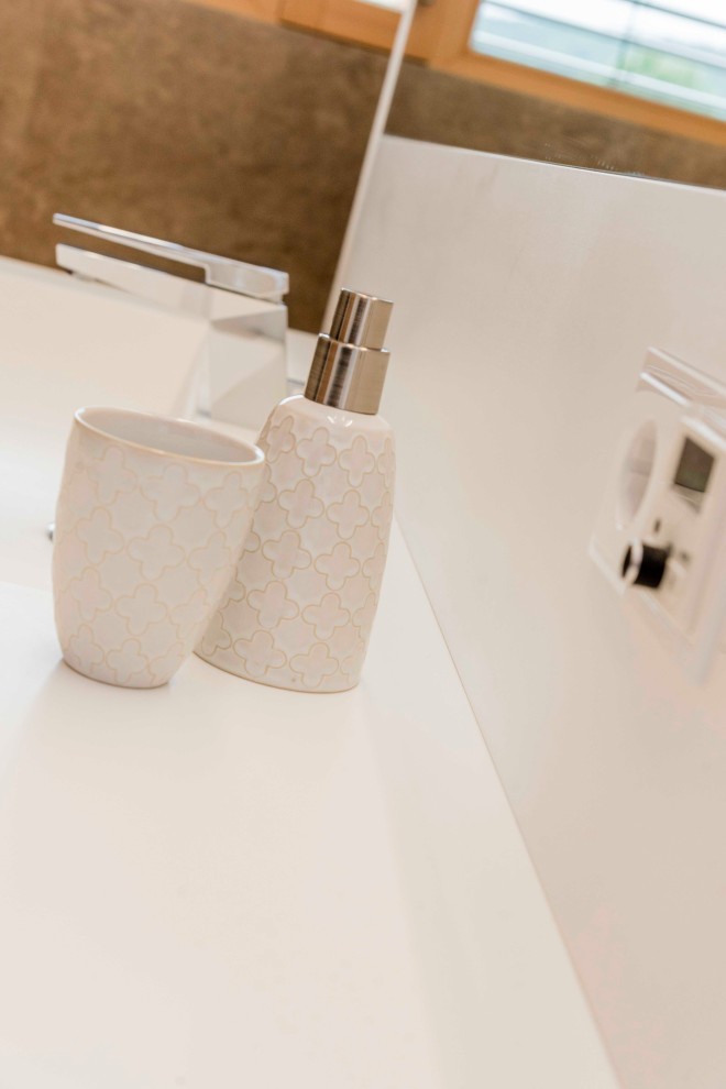 Ispirazione per una stanza da bagno design di medie dimensioni con vasca freestanding, lavabo da incasso, top in superficie solida, top bianco, un lavabo e mobile bagno incassato