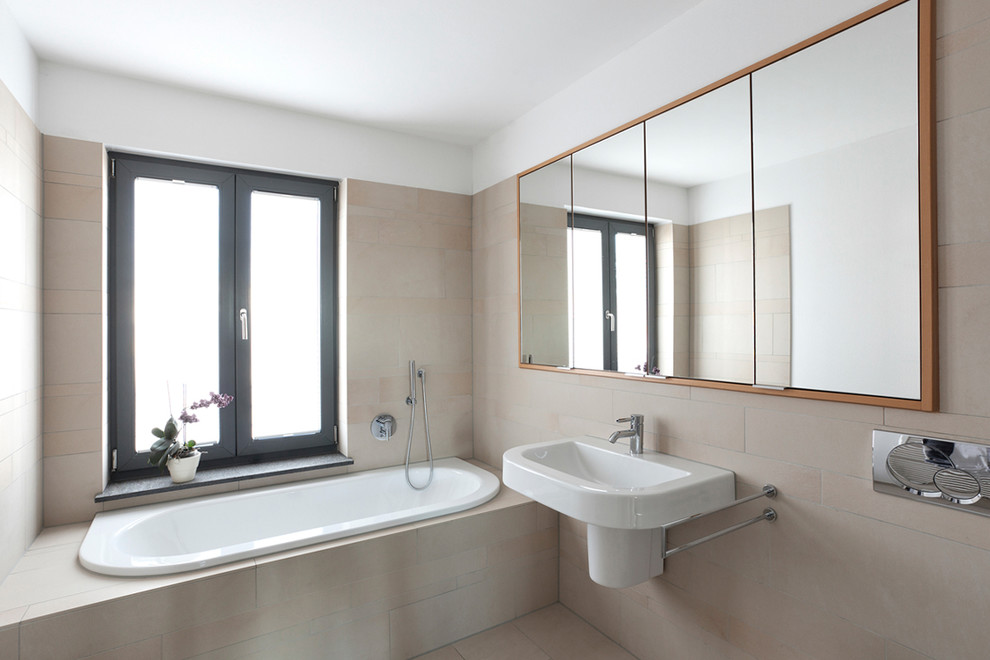 На фото: ванная комната среднего размера в современном стиле с накладной ванной, бежевой плиткой, белыми стенами, душевой кабиной и подвесной раковиной