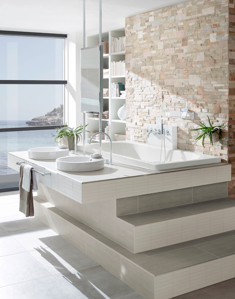 Design ideas for a medium sized contemporary shower room bathroom in Other with a vessel sink, tiled worktops, a built-in bath, a built-in shower, a two-piece toilet, grey tiles, ceramic tiles, grey walls and ceramic flooring.