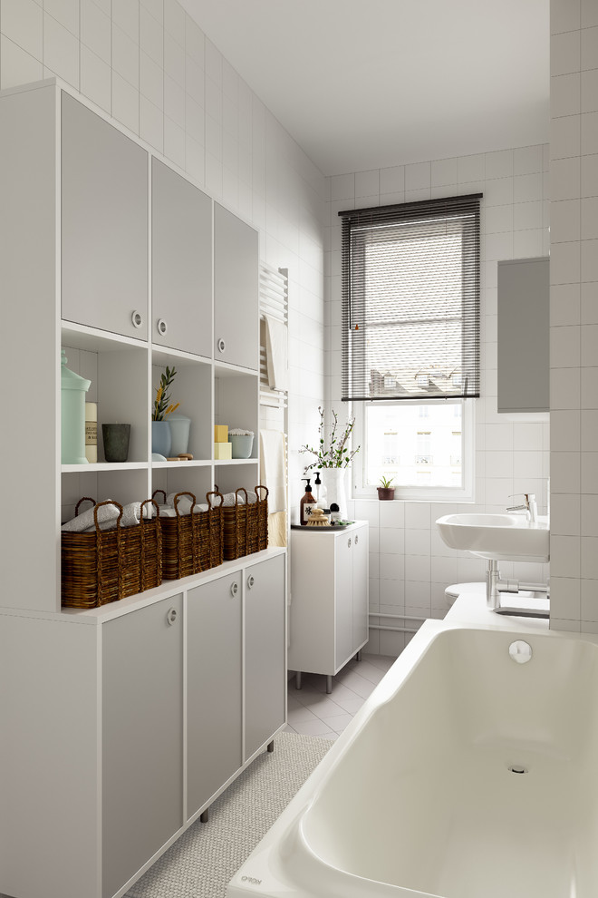 Small contemporary shower room bathroom in Berlin with white cabinets, white tiles, white walls, ceramic flooring, a wall-mounted sink, beige floors, a built-in bath, a built-in shower, a wall mounted toilet and wooden worktops.