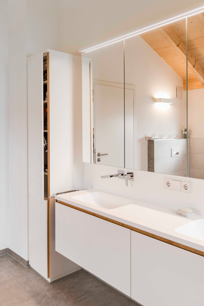 Mittelgroßes Modernes Badezimmer En Suite mit weißen Schränken, Einbauwaschbecken, Mineralwerkstoff-Waschtisch, weißer Waschtischplatte, Doppelwaschbecken und eingebautem Waschtisch in München