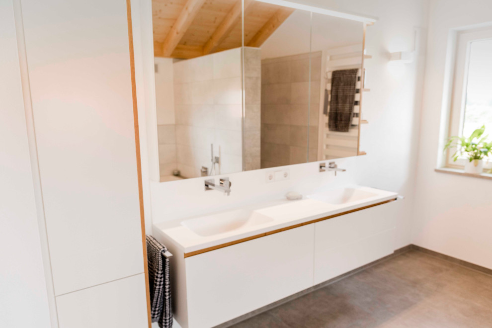 Idee per una stanza da bagno padronale minimal di medie dimensioni con ante bianche, lavabo da incasso, top in superficie solida, top bianco, due lavabi e mobile bagno incassato