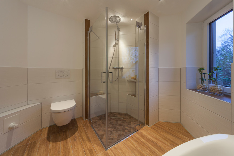 Medium sized country bathroom in Dresden with dark wood cabinets, a corner bath, a built-in shower, a two-piece toilet, white tiles, ceramic tiles, white walls, ceramic flooring, a built-in sink and solid surface worktops.