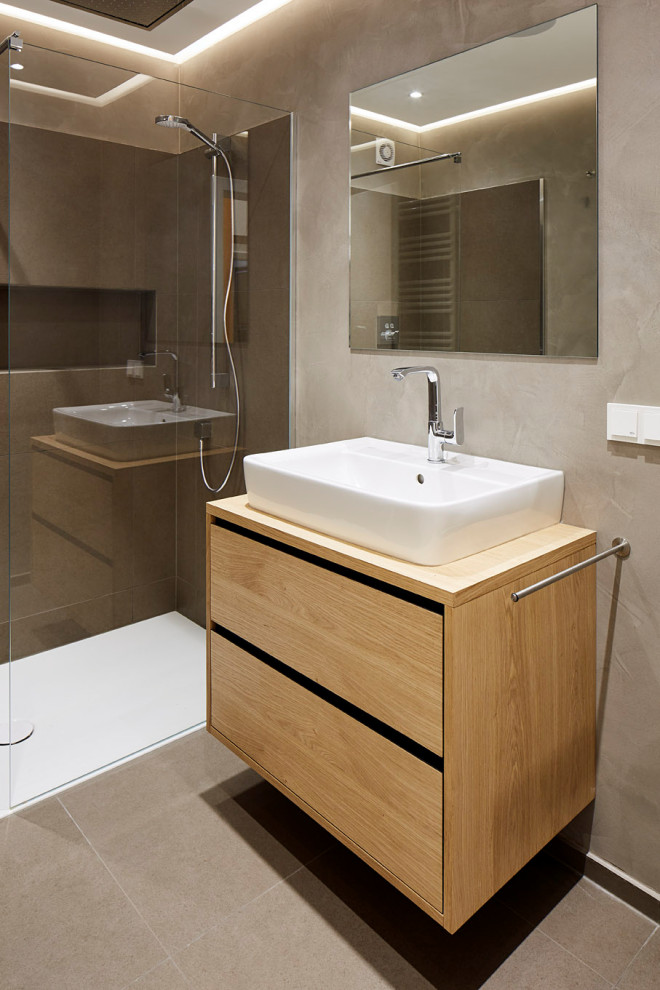 Medium sized contemporary shower room bathroom in Other with flat-panel cabinets, light wood cabinets, an alcove shower, grey tiles, porcelain tiles, porcelain flooring, a vessel sink, wooden worktops, grey floors, beige worktops, a wall niche, a single sink and a floating vanity unit.