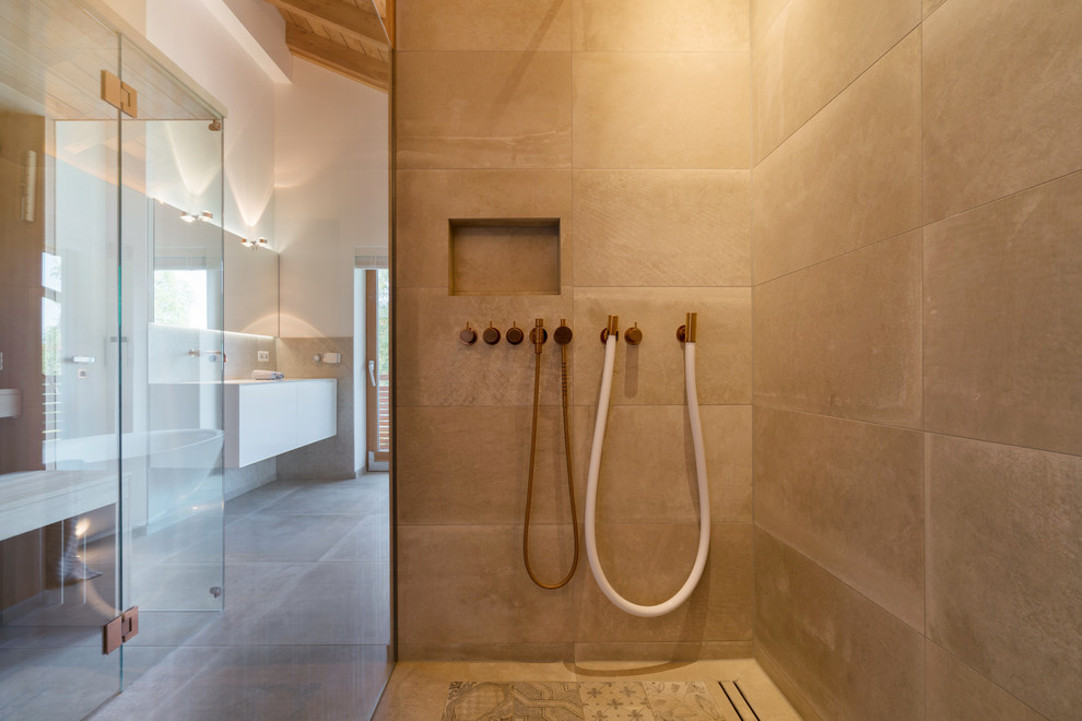 Medium sized contemporary ensuite bathroom in Munich with a freestanding bath, a built-in shower, white walls, an integrated sink, solid surface worktops, grey floors, an open shower and white worktops.
