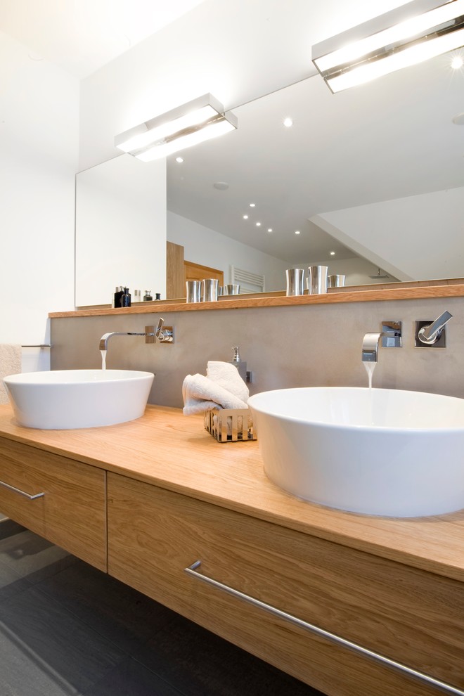Design ideas for a contemporary bathroom in Munich with a vessel sink.