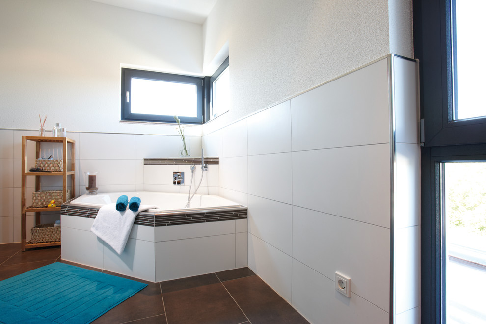 Design ideas for a contemporary bathroom in Other with a corner bath, white tiles, white walls and brown floors.