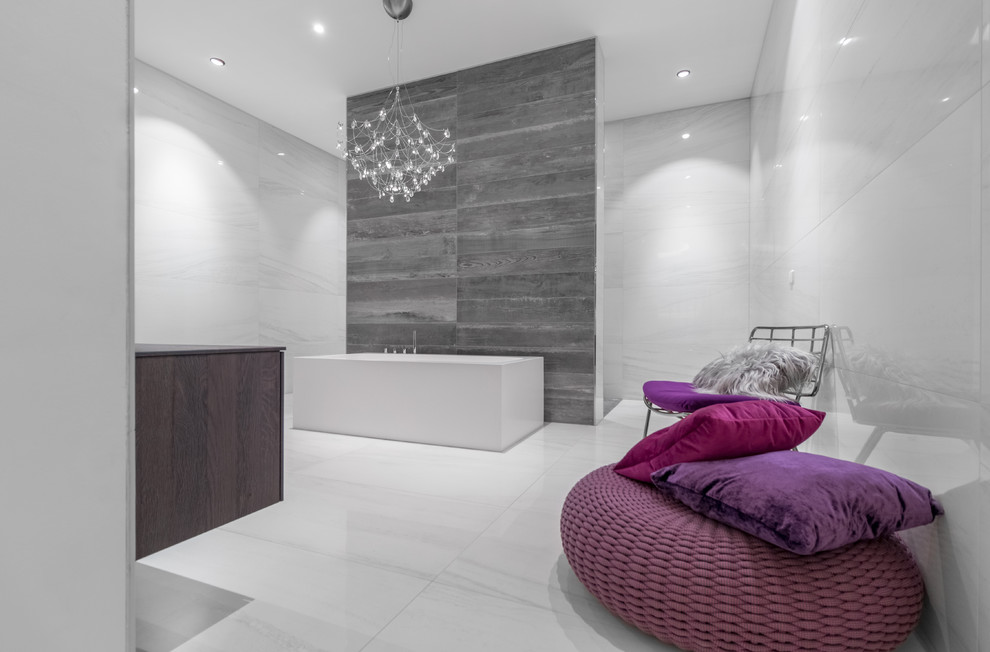 This is an example of a large contemporary grey and purple ensuite bathroom in Munich with flat-panel cabinets, dark wood cabinets, a freestanding bath, grey tiles, white tiles, ceramic tiles, ceramic flooring and white floors.