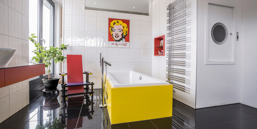 Mid-sized 1960s 3/4 white tile and porcelain tile porcelain tile and black floor freestanding bathtub photo in Other with flat-panel cabinets, red cabinets, white walls and a vessel sink