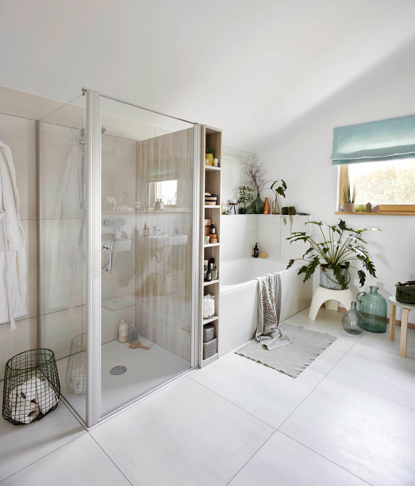 На фото: ванная комната среднего размера в современном стиле с накладной ванной, душем без бортиков, белой плиткой и душем с распашными дверями