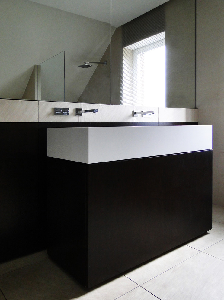Example of a small minimalist 3/4 cement tile floor and beige floor bathroom design in Bremen with flat-panel cabinets, brown cabinets, white walls, a vessel sink and solid surface countertops