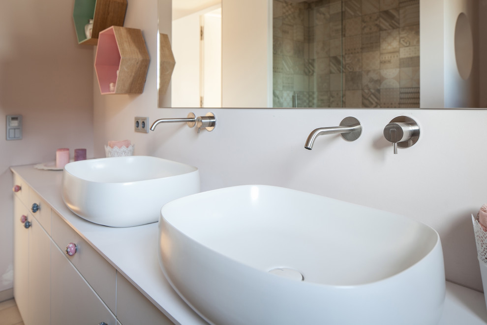 Photo of a medium sized contemporary bathroom in Munich with open cabinets, white cabinets, a built-in bath, a built-in shower, a wall mounted toilet, blue tiles, ceramic tiles, grey walls, light hardwood flooring, a wall-mounted sink, concrete worktops, brown floors and an open shower.