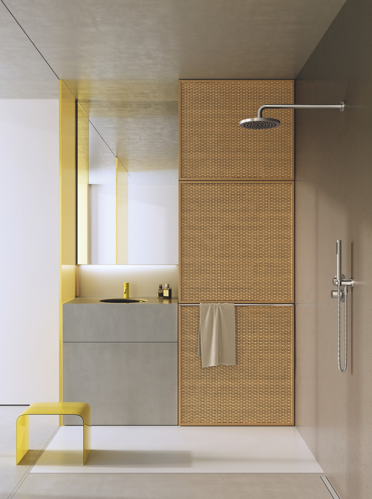 Immagine di una stanza da bagno con doccia minimalista di medie dimensioni con ante lisce, ante grigie, doccia aperta, piastrelle grigie, pareti grigie, lavabo integrato, top in cemento e top grigio