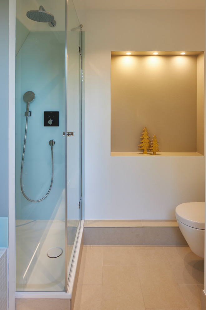 Photo of a contemporary ensuite bathroom in Dusseldorf with white cabinets, a built-in bath, an alcove shower, a wall mounted toilet, glass sheet walls, white walls, limestone flooring, beige floors, brown worktops, a shower bench, a single sink and a freestanding vanity unit.