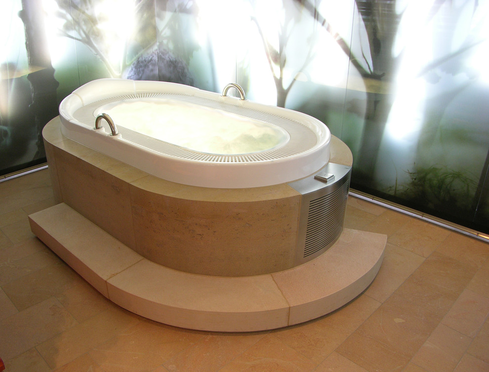 На фото: ванная комната в современном стиле с бежевыми фасадами, отдельно стоящей ванной, душем без бортиков, унитазом-моноблоком, мраморной плиткой, бежевыми стенами, кирпичным полом, накладной раковиной, столешницей из бетона, бежевым полом и шторкой для ванной
