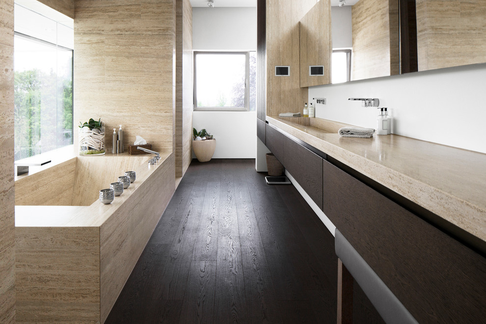 Medium sized contemporary bathroom in Munich with an alcove shower, white walls, dark hardwood flooring, an integrated sink, flat-panel cabinets, dark wood cabinets, beige tiles, stone slabs and limestone worktops.