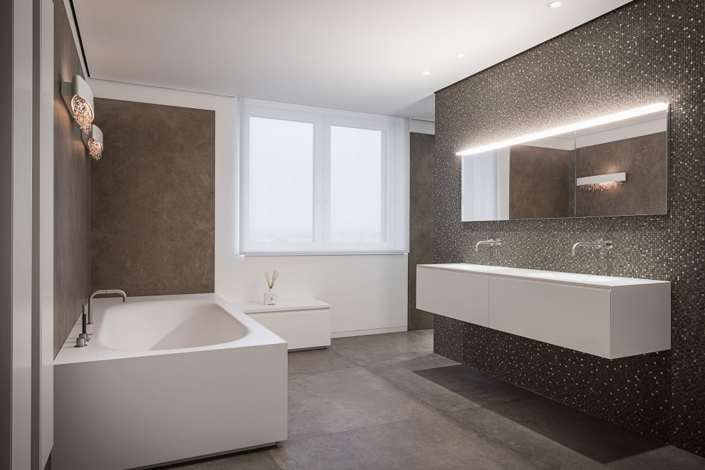 Foto på ett funkis vit badrum, med ett fristående badkar, grå väggar, ett undermonterad handfat, bänkskiva i akrylsten och grått golv