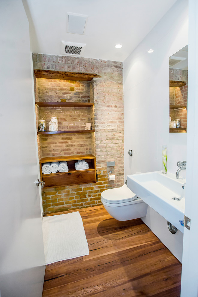 Inspiration for an industrial light wood floor and brown floor bathroom remodel in New York