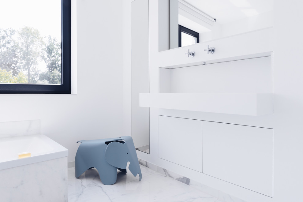 This is an example of a small modern family bathroom in Hamburg with flat-panel cabinets, a built-in bath, a built-in shower, ceramic tiles, white walls, ceramic flooring, a built-in sink, solid surface worktops, white floors, an open shower and white worktops.