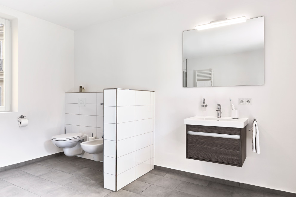 Large trendy 3/4 white tile and porcelain tile single-sink bathroom photo in Other with flat-panel cabinets, brown cabinets, an undermount tub, a two-piece toilet, white walls, a hinged shower door, brown countertops and a floating vanity