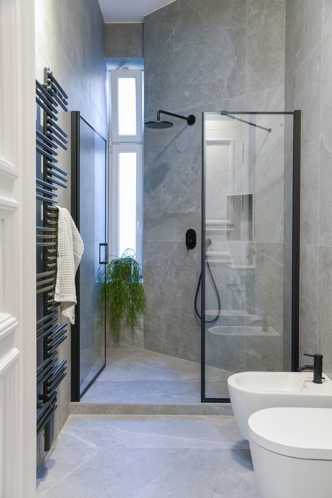 Example of a mid-sized trendy master gray tile and ceramic tile ceramic tile, gray floor and single-sink walk-in shower design in Berlin with gray cabinets, a two-piece toilet, white walls, a wall-mount sink, solid surface countertops, a hinged shower door, white countertops and a floating vanity