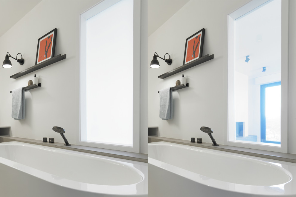 Immagine di una stanza da bagno contemporanea di medie dimensioni con ante lisce, ante grigie, vasca freestanding, pistrelle in bianco e nero, pareti bianche, pavimento grigio e top grigio
