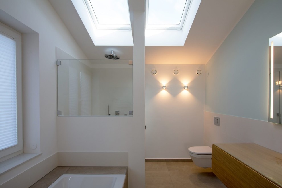 Photo of a medium sized contemporary shower room bathroom in Hamburg with flat-panel cabinets, medium wood cabinets, a built-in bath, a built-in shower, a two-piece toilet, white tiles, stone tiles, white walls, porcelain flooring, brown floors, an open shower and brown worktops.