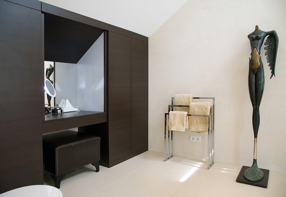 Large contemporary bathroom in Frankfurt with flat-panel cabinets, dark wood cabinets and beige walls.