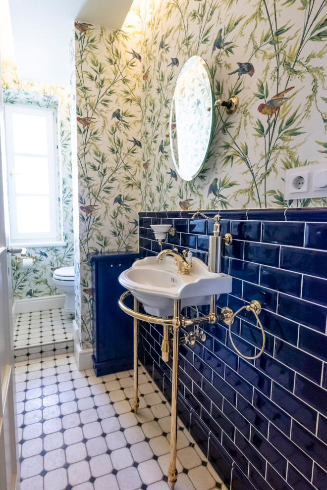 Medium sized classic bathroom in Munich with a wall mounted toilet, blue tiles, ceramic flooring, a console sink, a single sink, a freestanding vanity unit and wallpapered walls.