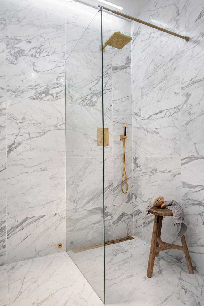 This is an example of a large modern shower room bathroom in Stockholm with an alcove shower, grey tiles, grey walls, marble flooring and an open shower.