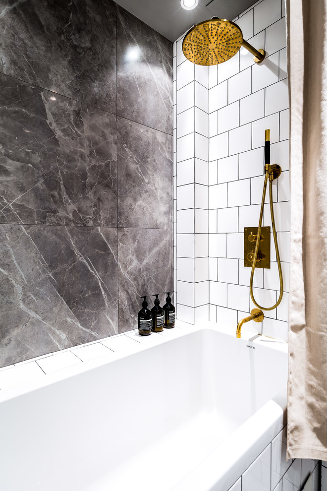Design ideas for a classic bathroom in Stockholm with an alcove bath, a shower/bath combination, grey tiles, white tiles and a shower curtain.
