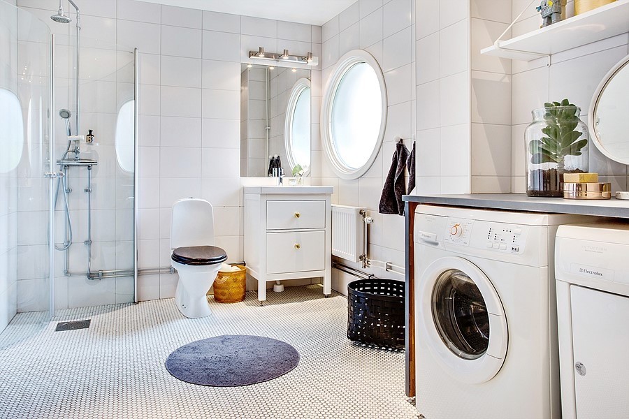Medium sized scandi shower room bathroom in Stockholm with open cabinets, white cabinets, a corner shower, a one-piece toilet, white tiles, white walls, a built-in sink, wooden worktops, white floors and a hinged door.