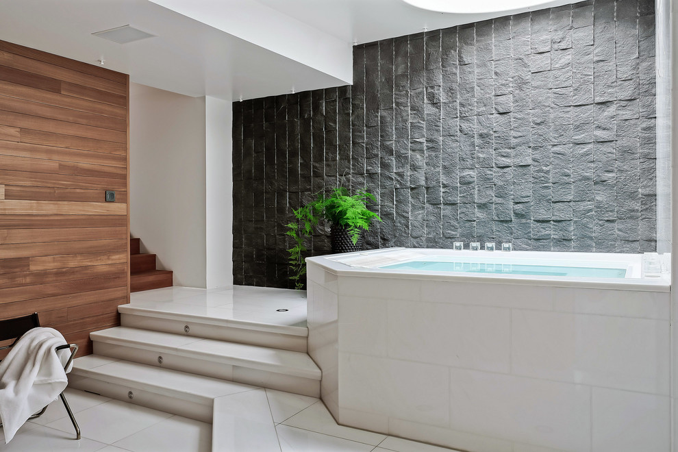 На фото: ванная комната среднего размера в современном стиле с накладной ванной, серой плиткой и плиткой из сланца