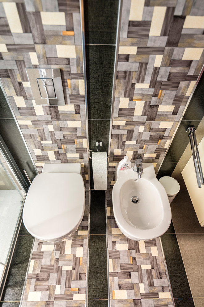 Photo of a small modern cloakroom in Catania-Palermo with flat-panel cabinets, light wood cabinets, a wall mounted toilet, black tiles, ceramic tiles, grey walls, ceramic flooring, a built-in sink, laminate worktops and yellow worktops.