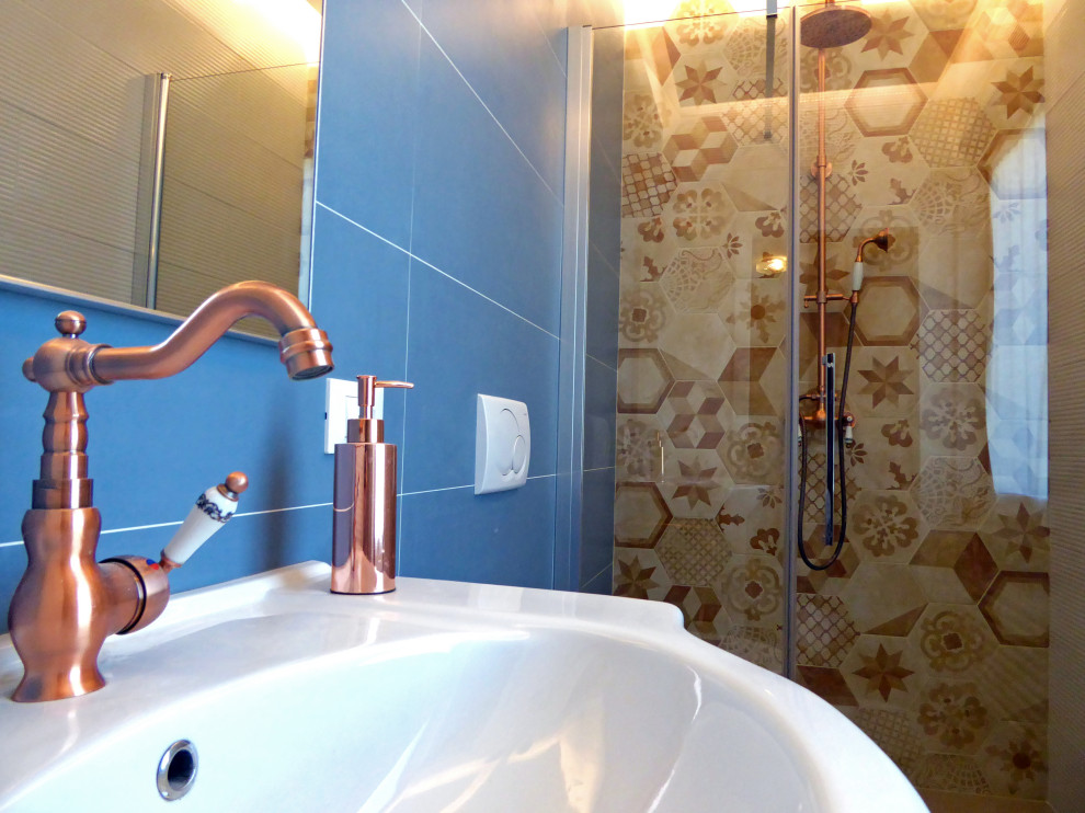 Photo of a small modern bathroom in Venice with freestanding cabinets, brown cabinets, a two-piece toilet, orange tiles, porcelain tiles, blue walls, porcelain flooring, an integrated sink, tiled worktops, beige floors, white worktops, a freestanding vanity unit, a drop ceiling and panelled walls.