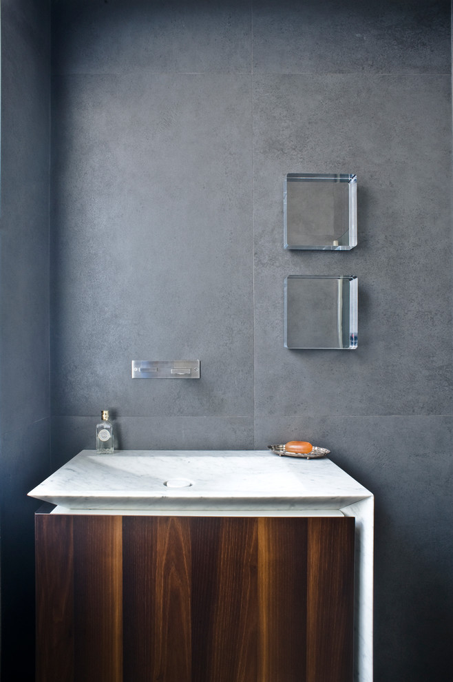 Photo of a contemporary cloakroom in Other with an integrated sink.