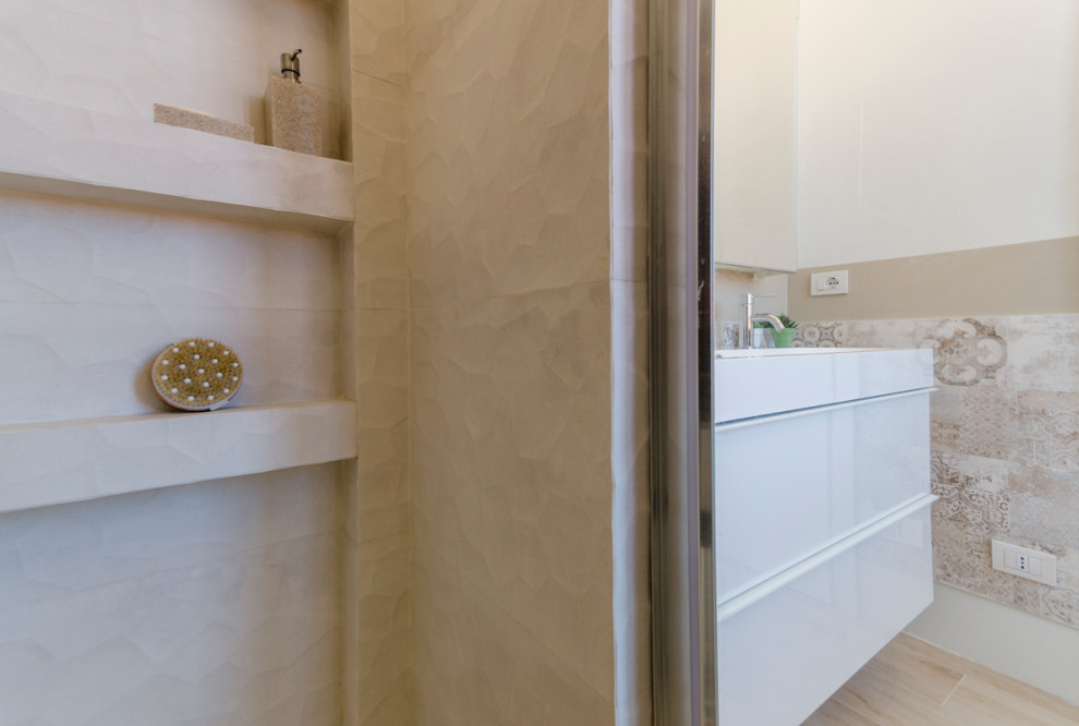 Small modern cloakroom in Milan with flat-panel cabinets, white cabinets, a two-piece toilet, multi-coloured tiles, porcelain tiles, wood-effect flooring, an integrated sink, engineered stone worktops, beige floors, white worktops and a floating vanity unit.