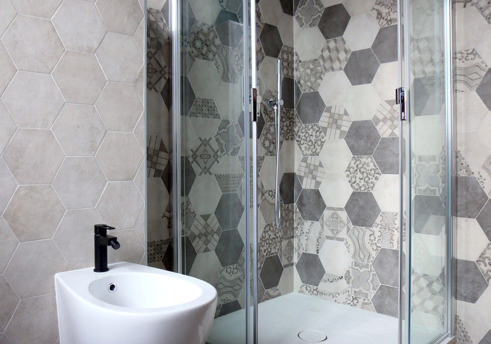 Example of a small trendy multicolored tile and cement tile concrete floor and gray floor bathroom design in Milan with flat-panel cabinets, dark wood cabinets, a two-piece toilet, blue walls, an integrated sink and solid surface countertops